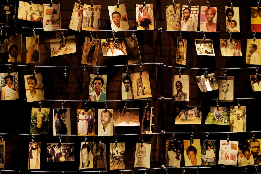 Family photographs of some of those who died in the Rwandan genocide hang on display