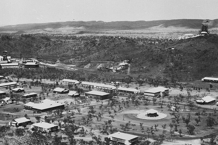 A black and white old photo of an outback town