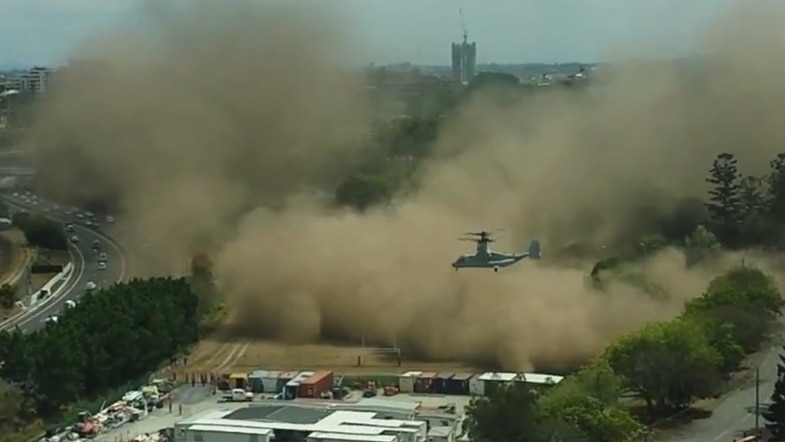 US Osprey aircraft create a dust cloud in Brisbane