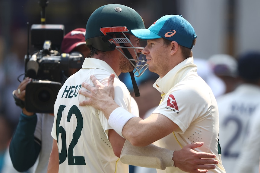 Steve Smith shakes hands with Travis Head after Australia defeated India in Indore.