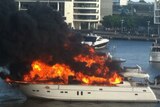 Fire engulfs a luxury 80-foot yacht moored at Docklands in Melbourne.