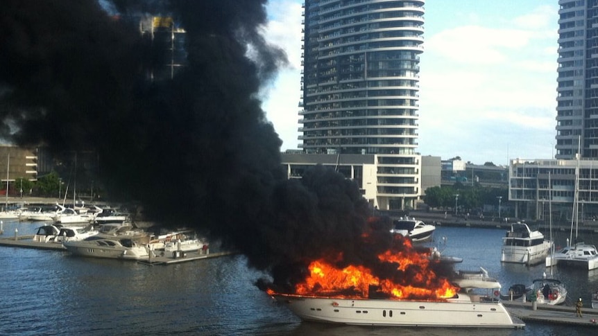 Fire engulfs a luxury 80-foot yacht moored at Docklands in Melbourne.