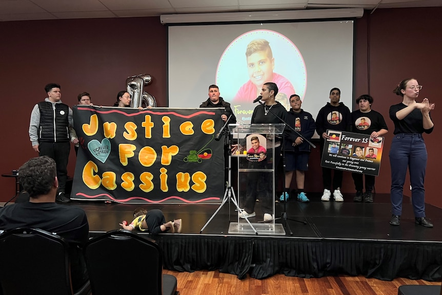 A woman speaks at a vigil for Cassius Turvey in Melbourne.