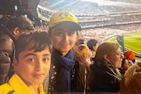 Picture of a boy and a girl in a cricket stadium 