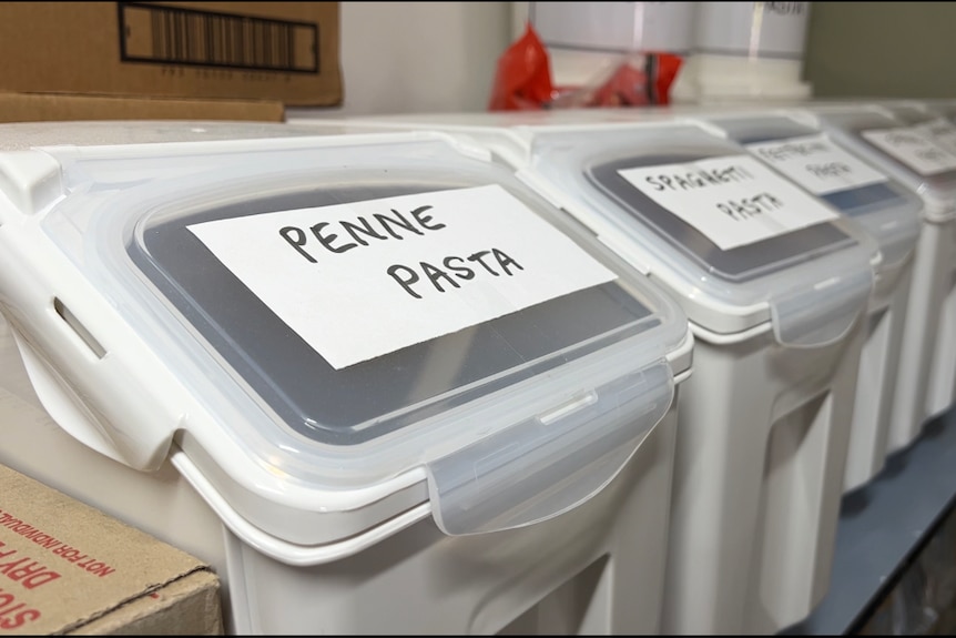 White plastic bins with labels: Penne Pasta, Spaghetti Pasta