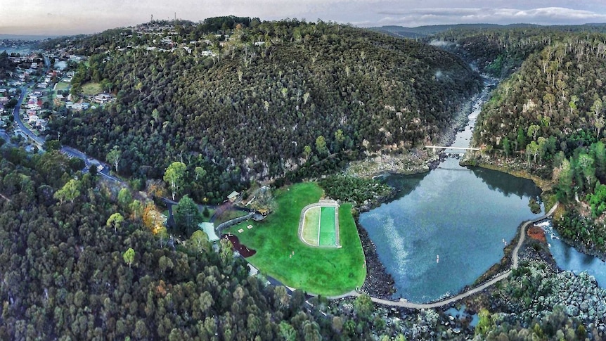 An aerial view of Launceston's Cataract Gorge Reserve with its suspension bridge, First Basin and pool.