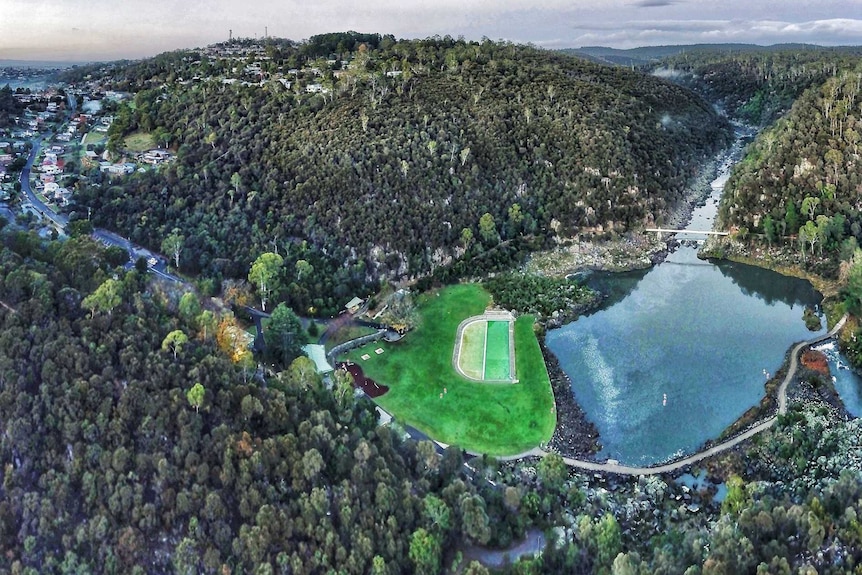 An aerial view of Launceston's Cataract Gorge Reserve with its suspension bridge, First Basin and pool.