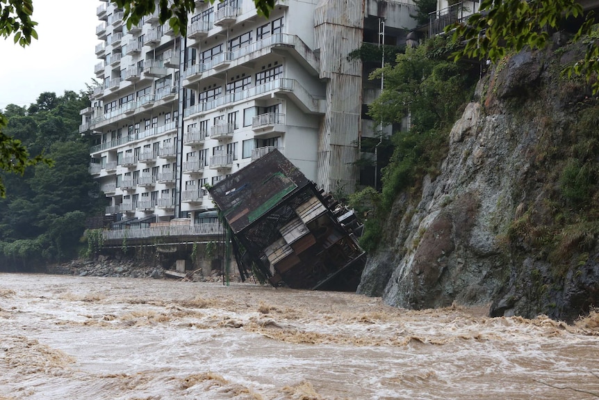 Hotel building falls into the floodwaters at Nikko mountain resort