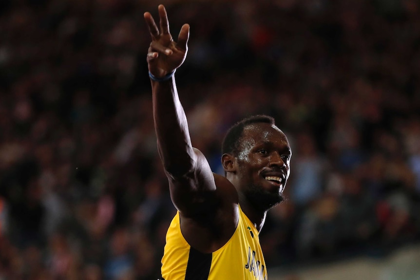 Usain Bolt of Jamaica celebrates winning the heat.