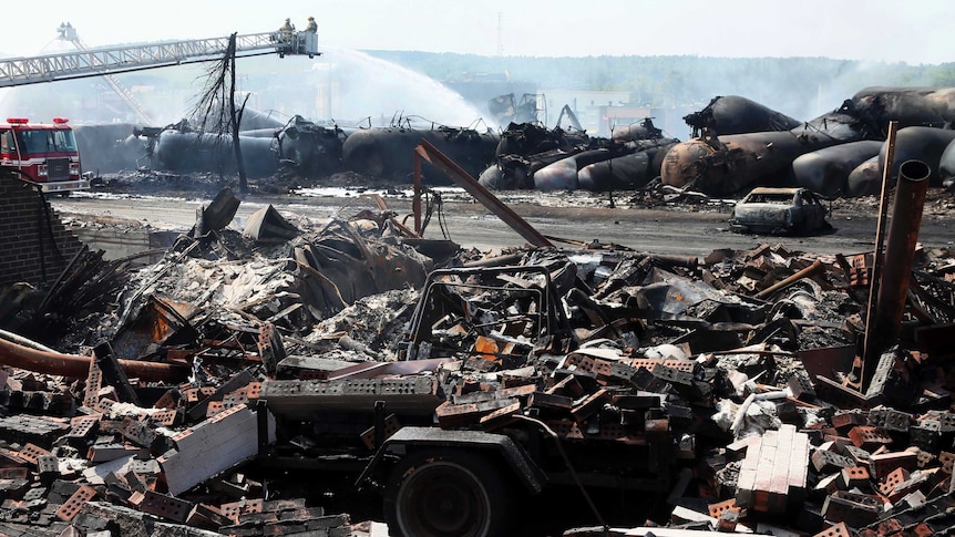 The remains of a home lie in rubble after the explosion in Lac-Megantic.