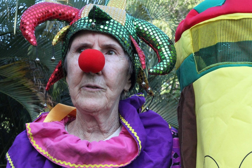 A woman in a court jester costume.