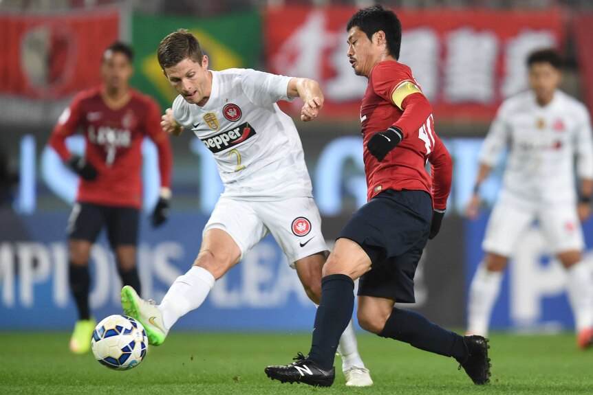 Shannon Cole wins possession against Kashima Antlers