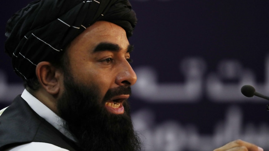 Taliban spokesman speaks animatedly during a press conference in Kabul on September 6, 2021.