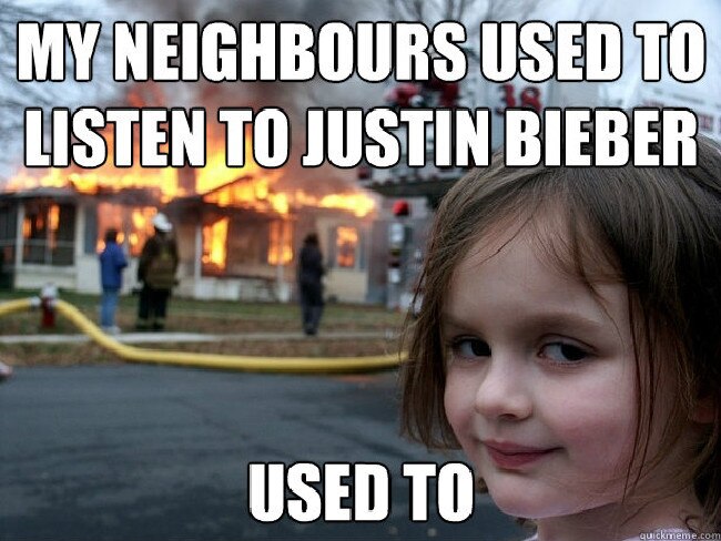 An example of the disaster girl meme which reads 'My neighbours used to listen to Justin Bieber. Used to'.