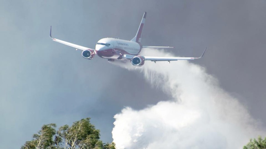 Boeing 737 water bomber dropping water over the catastrophic bushfires.