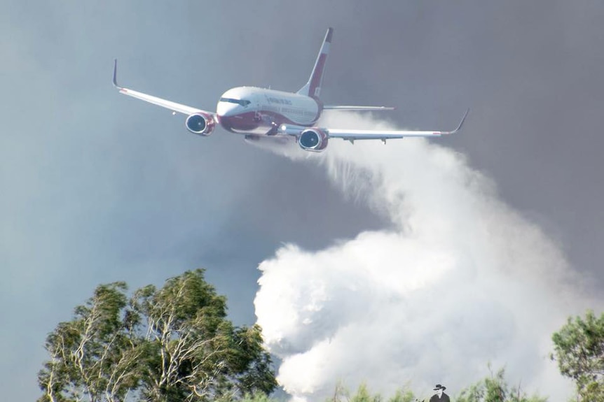 Boeing 737 water bomber dropping water over the catastrophic bushfires in central Queensland.