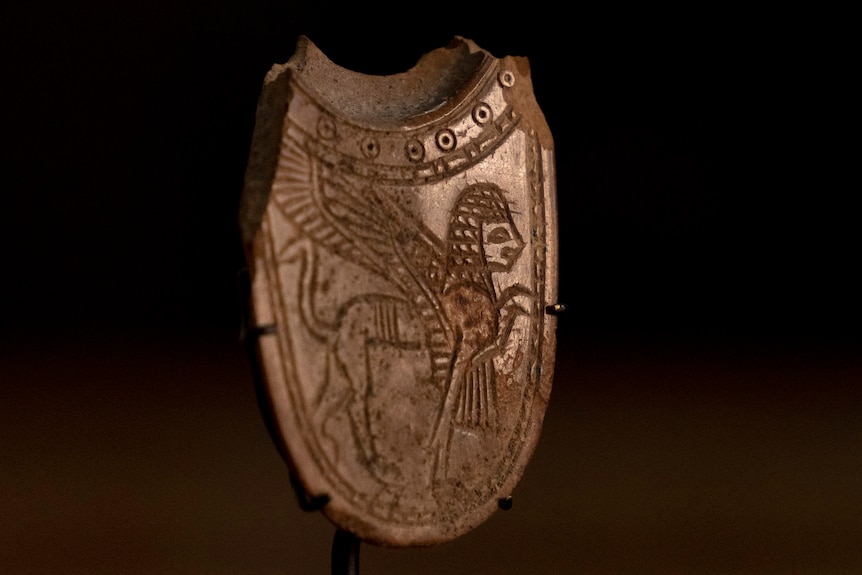 A 2,700-year-old ivory incense spoon on display.