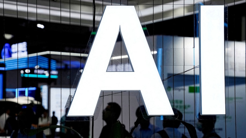 A glowing sign with the letters AI at a conference.  