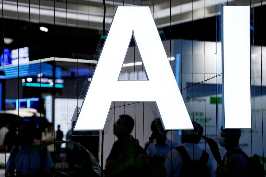 A glowing sign with the letters AI at a conference.  