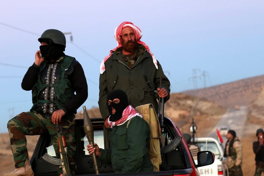 Kurdish forces outside the town of Sinjar.