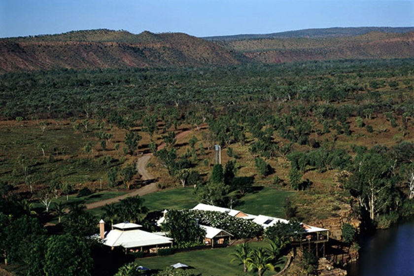 An aerial view of the El Questro homestead resort with the Cockburn Ranges beyond