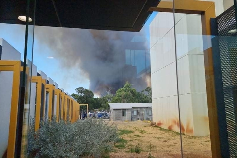 Smoke viewed through a hospital window.