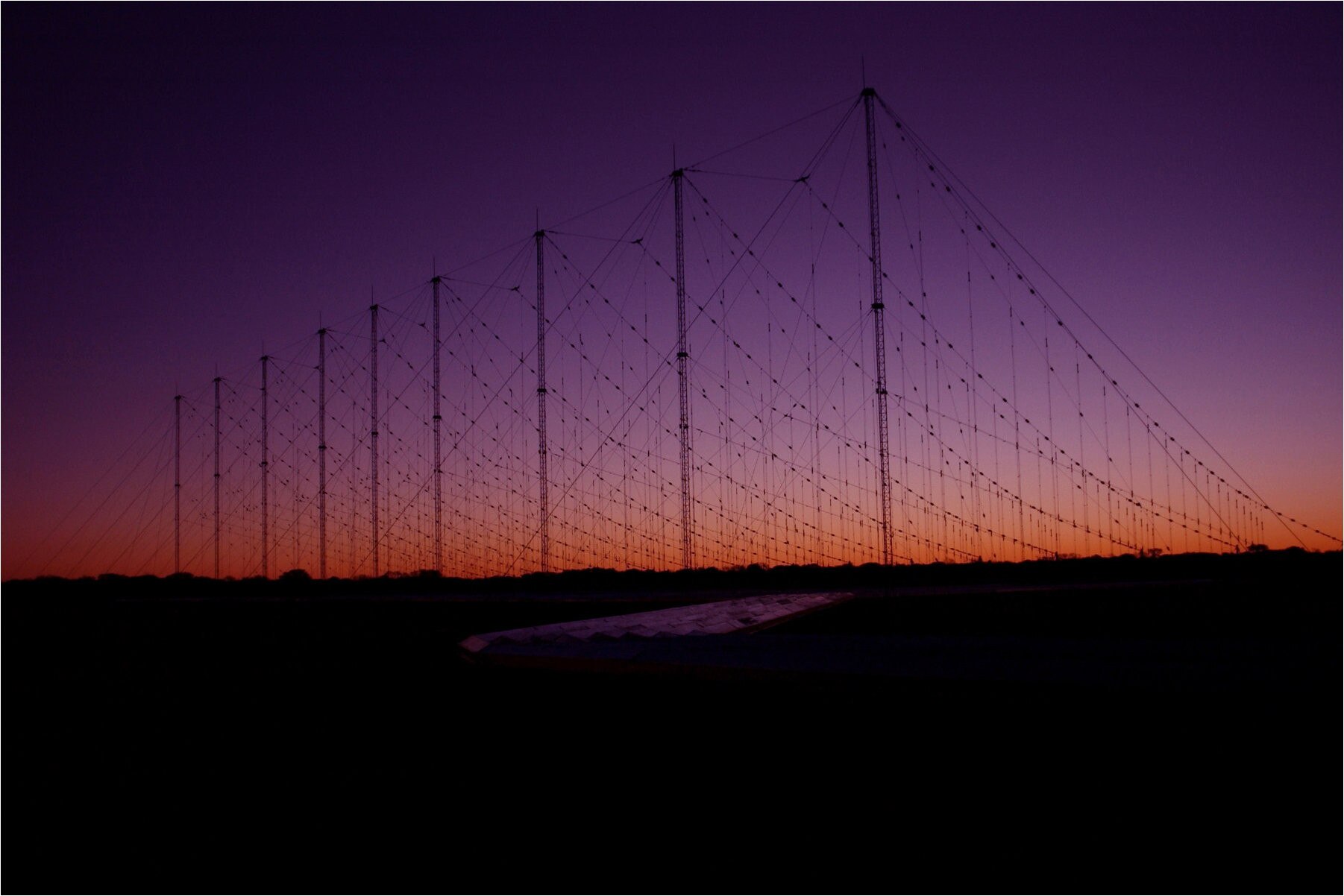 Rows of antennas seen at sunset.