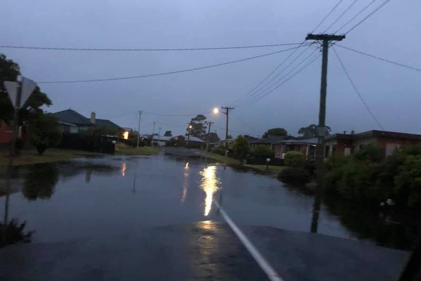 Water over a suburban road after heavy rain