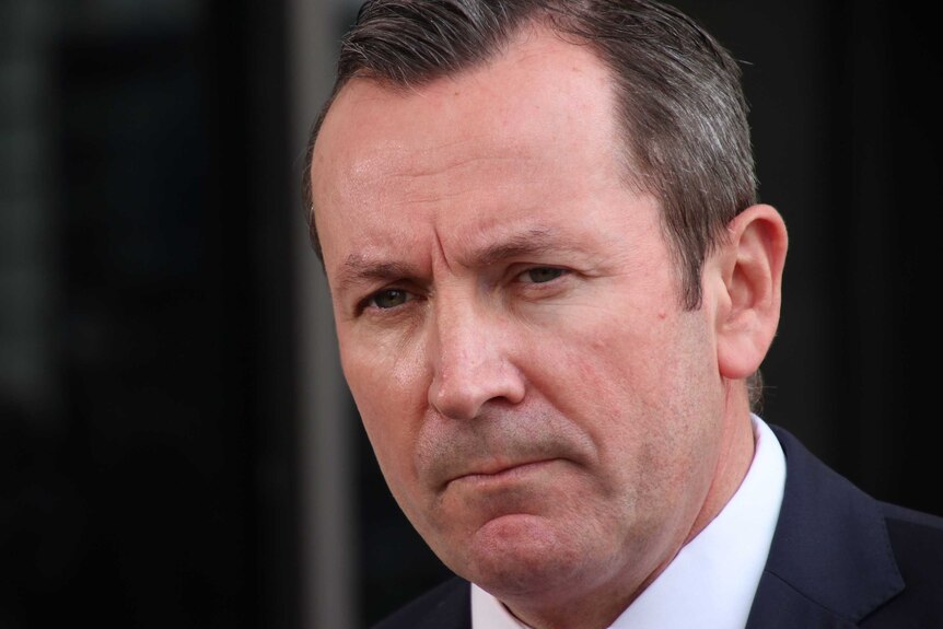 A close up of Mark McGowan's face, looking concerned.