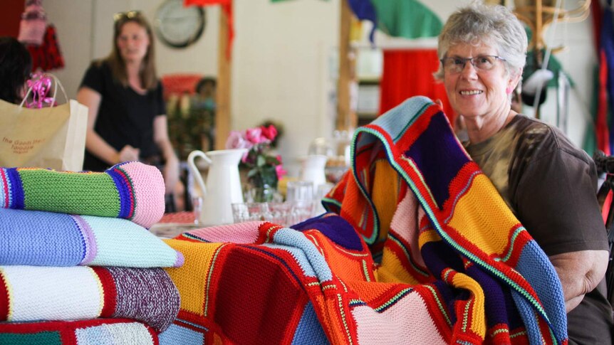 Roslyn Slimmon, part of the Knitters for Good for the last year is displaying one of the knitted blankets.