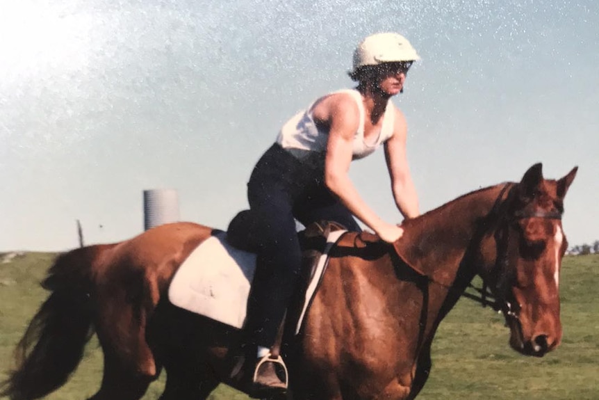 An old supplied photo of a young woman riding a horse.