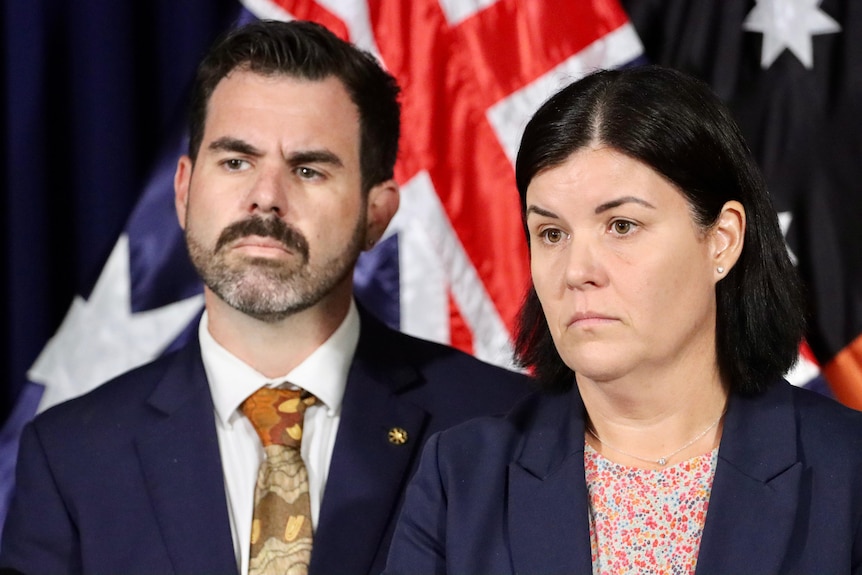 NT Attorney-General Chansey Paech and Chief Minister Natasha Fyles, standing at a lectern and looking serious.