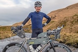 Mike Hall poses with a mountain bike.