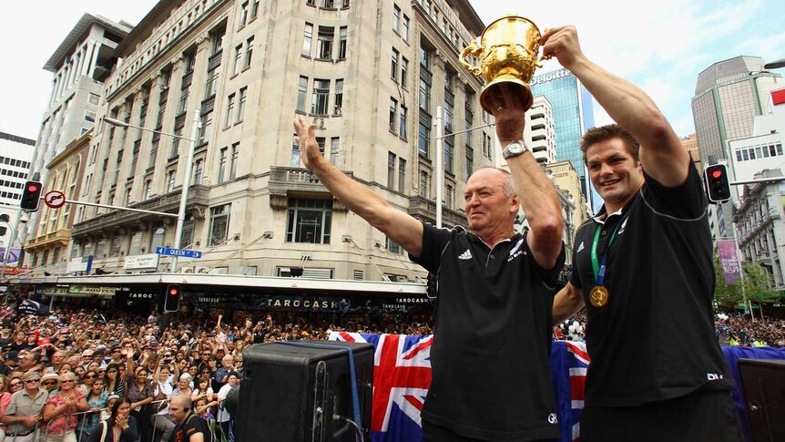 Henry and McCaw hold up the World Cup