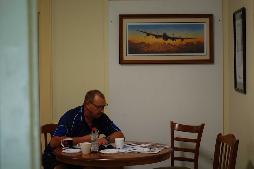 Retired Air Force Sergeant Matt Work sits at a table.