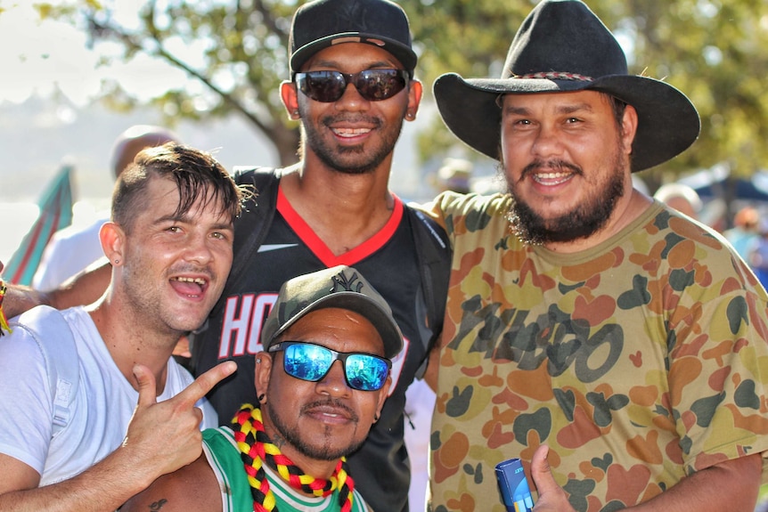 four men gather together for a photo at Langley Park for Australia Day