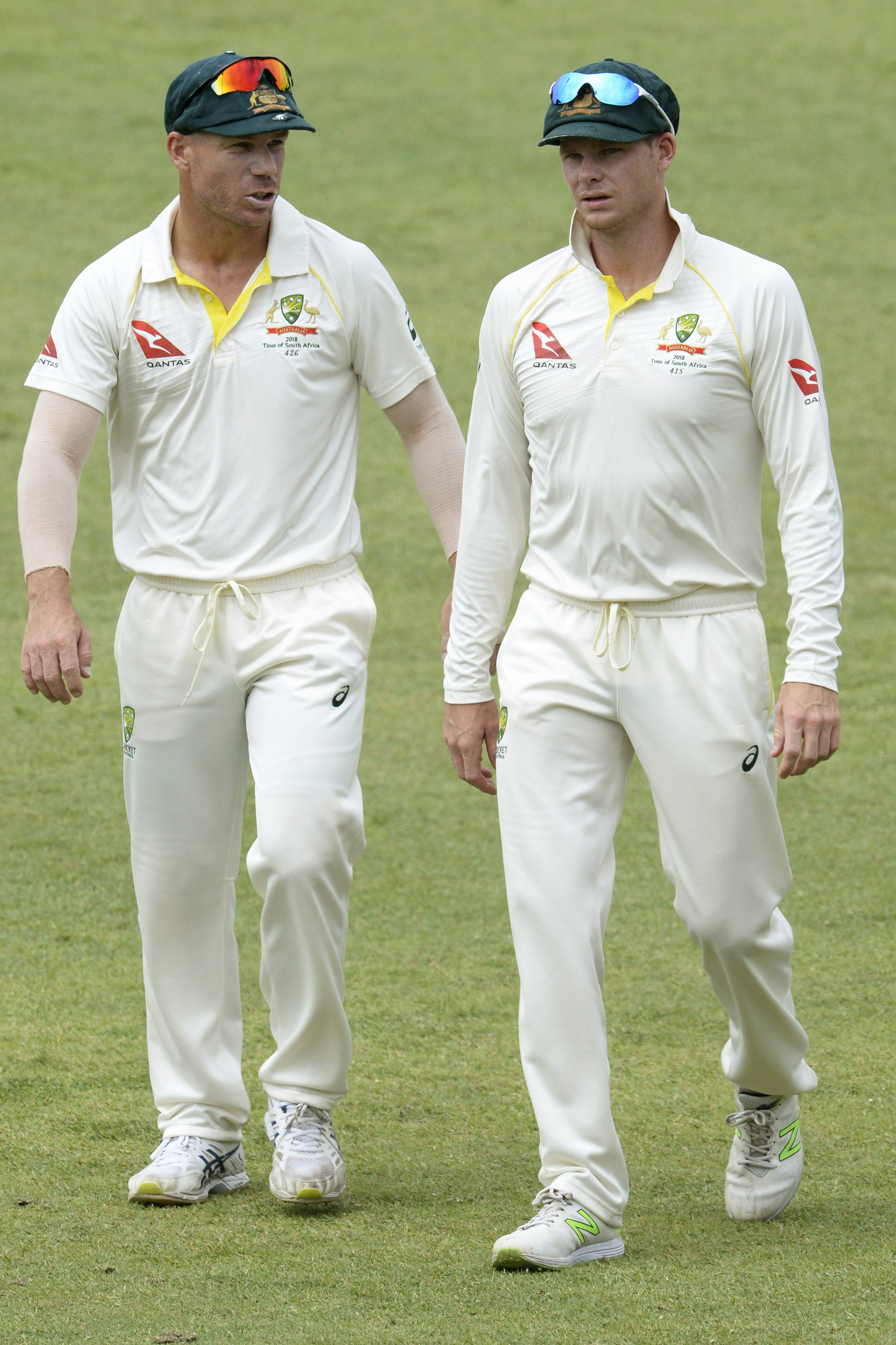David Warner and Steve Smith walk together