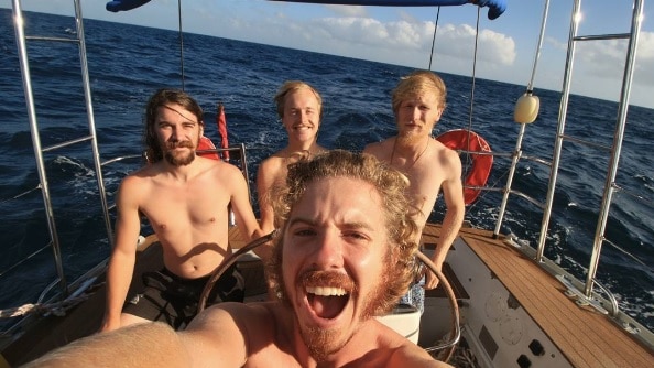 Bryce Waters and his crew after six months at sea. Selfie by Matt Small.