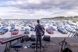 Mads Langer performing at the first drive-in concert at Aarhus, Denmark - April 2020