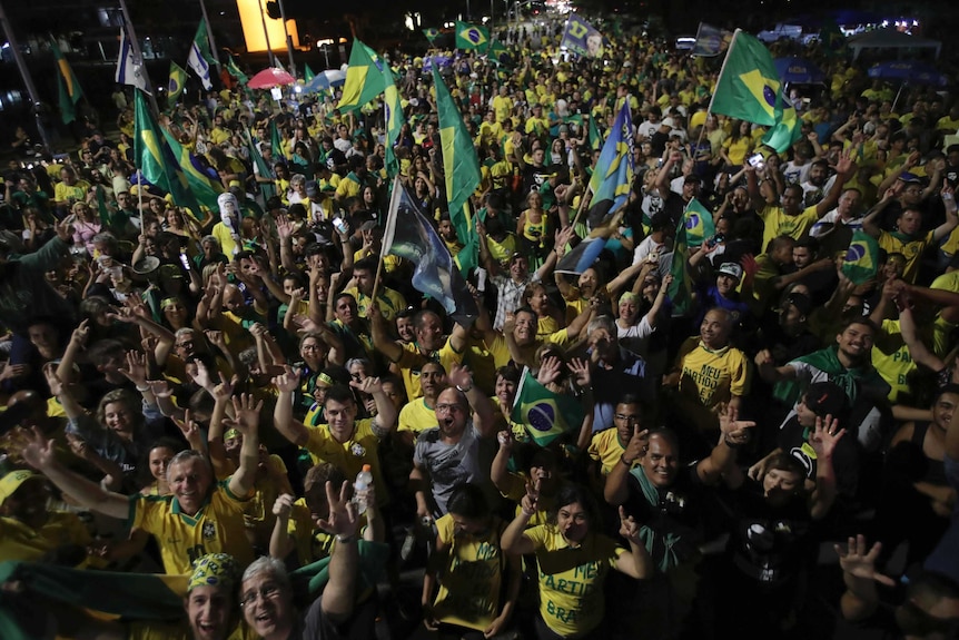 Supporters of Brazil president-elect Jair Bolsonaro celebrate in front of the National Congress in Brasilia.