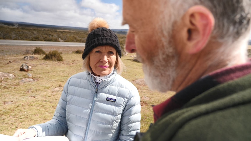 A woman holding a map.