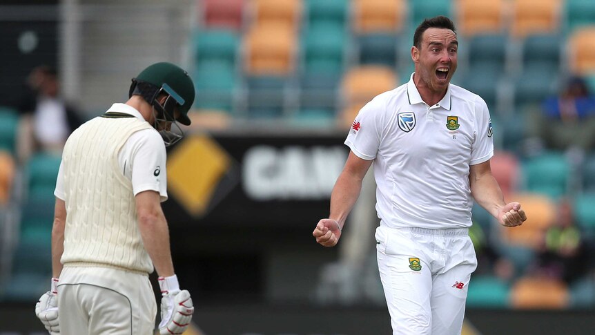 South Africa's Kyle Abbott (R), celebrates the wicket of Australia's Adam Voges in Hobart.