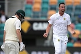 South Africa's Kyle Abbott (R), celebrates the wicket of Australia's Adam Voges in Hobart.