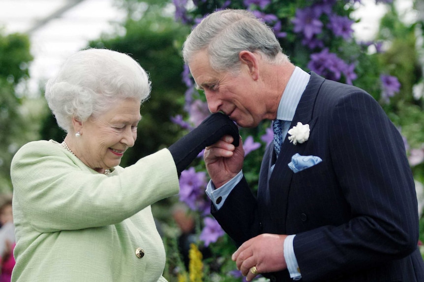 Britain's Prince Charles kisses the hand of his mother, Queen Elizabeth.