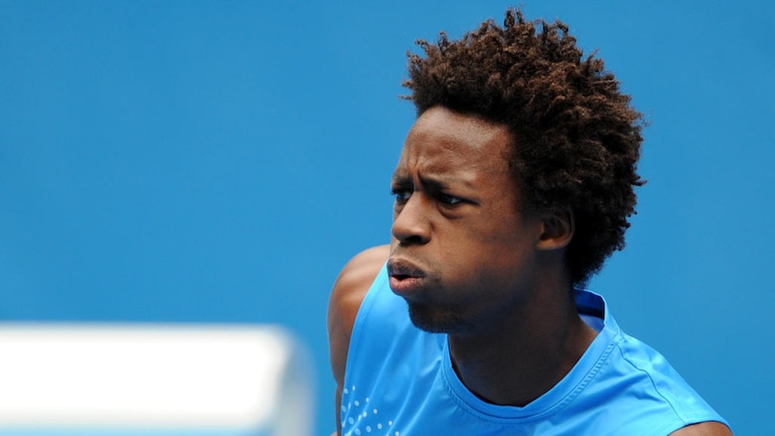 French gun Gael Monfils advanced to the third round with a straight-sets win over Ryan Sweeting.