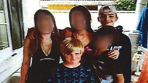 10 year-old Declan Hall-Alger and 14-year-old Tyrell Hall-Alger standing with other children whose faces have been blurred.