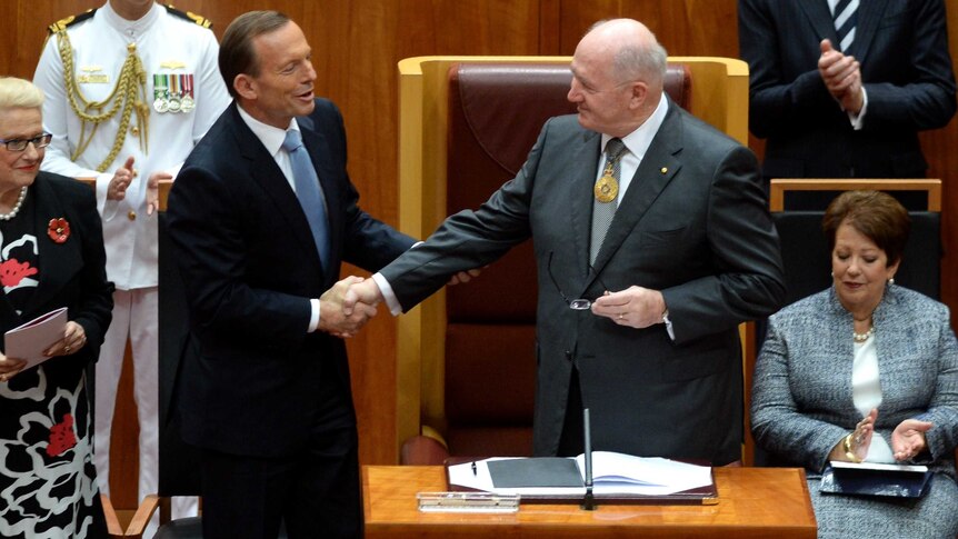 Prime Minister Tony Abbott, left, congratulates Governor-General Sir Peter Cosgrove after swearing in.
