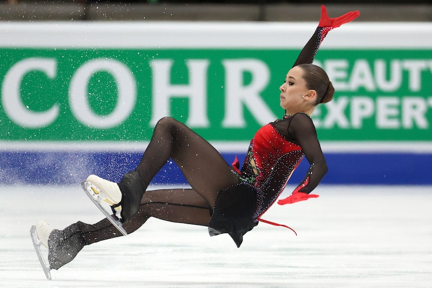 Kamila Valiyeva falls backwards on the ice