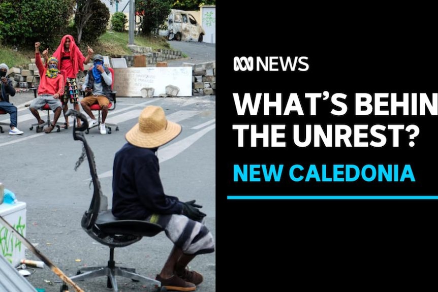 What's Behind The Unrest, New Caledonia: Man wearing a hat with his back to the camera sitting on a chair, a group sits nearby