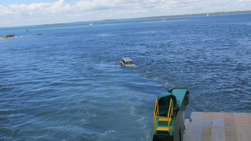 A four-wheel drive has fallen off a barge